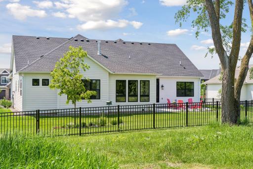 Better than new with a fence and gorgeous gardens installed.