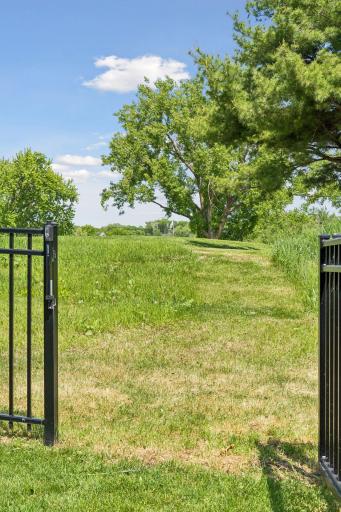 The gate is perfectly sized to drive the golf cart through.