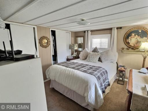 Welcome to this spacious primary bedroom with an abundance of closet space.