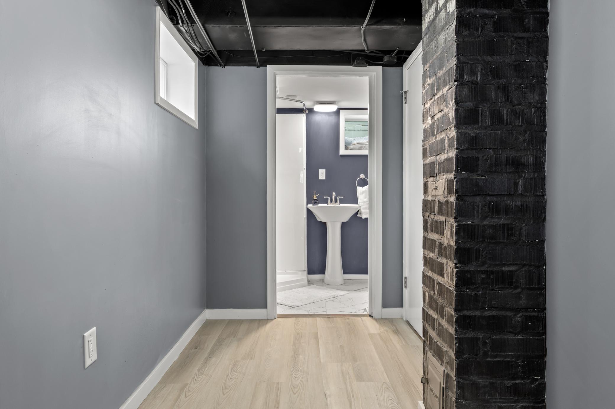 Basement hallway to bathroom