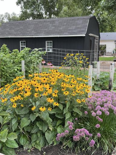 Some of the Many Beautiful Plantings Around this Well Cared for Home and Manicured Yard!!!