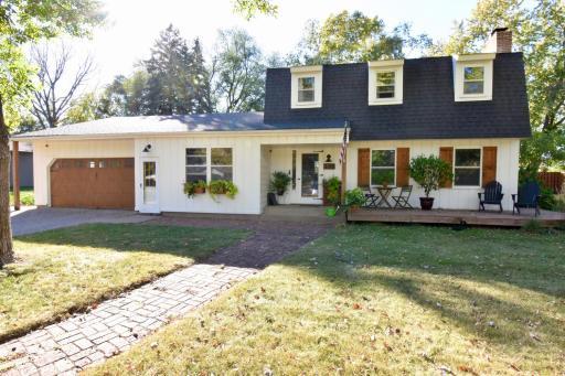 Amazing Curb Appeal with Paver Sidewalk, Inviting Front Porch, and Stunning Architectural Design!!!