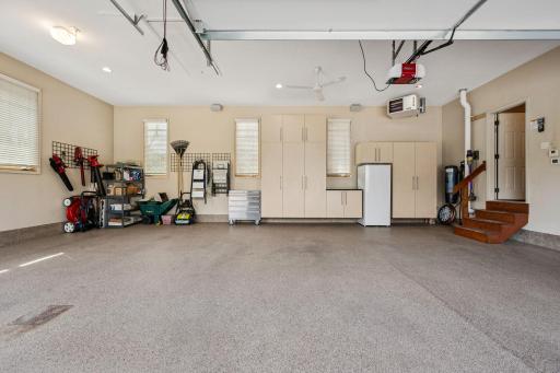 Insulated, heated, 3-car garage with epoxy floor and ample storage