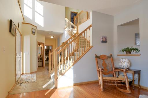 Open staircase leads to upper level loft area