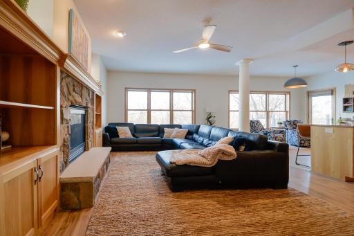 Main level living room with white pillar, serene nature views