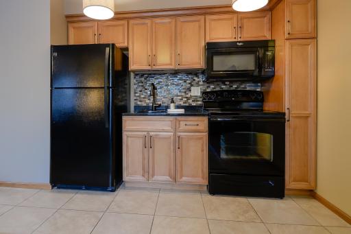 Kenmore fridge, GE stove, and Whirlpool microwave