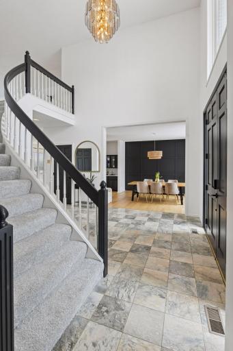 Your dream home is calling, "7041 Kenmare Drive!" A beautifully designed grand entry sets the tone immediately — refined tilework, architectural presence, and a welcoming scale that introduces the home with intention.