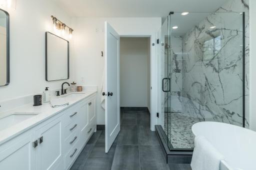 Private primary ensuite with separate shower and tub