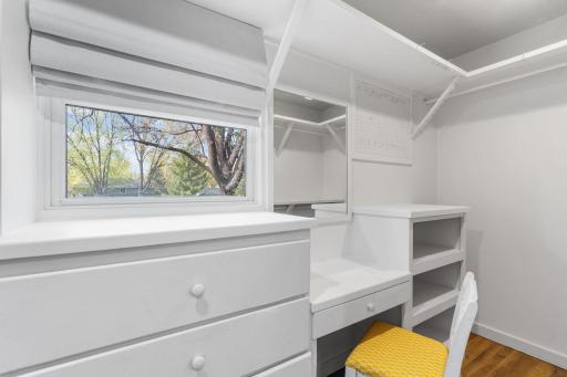 Oversized walk-in primary closet with custom organization