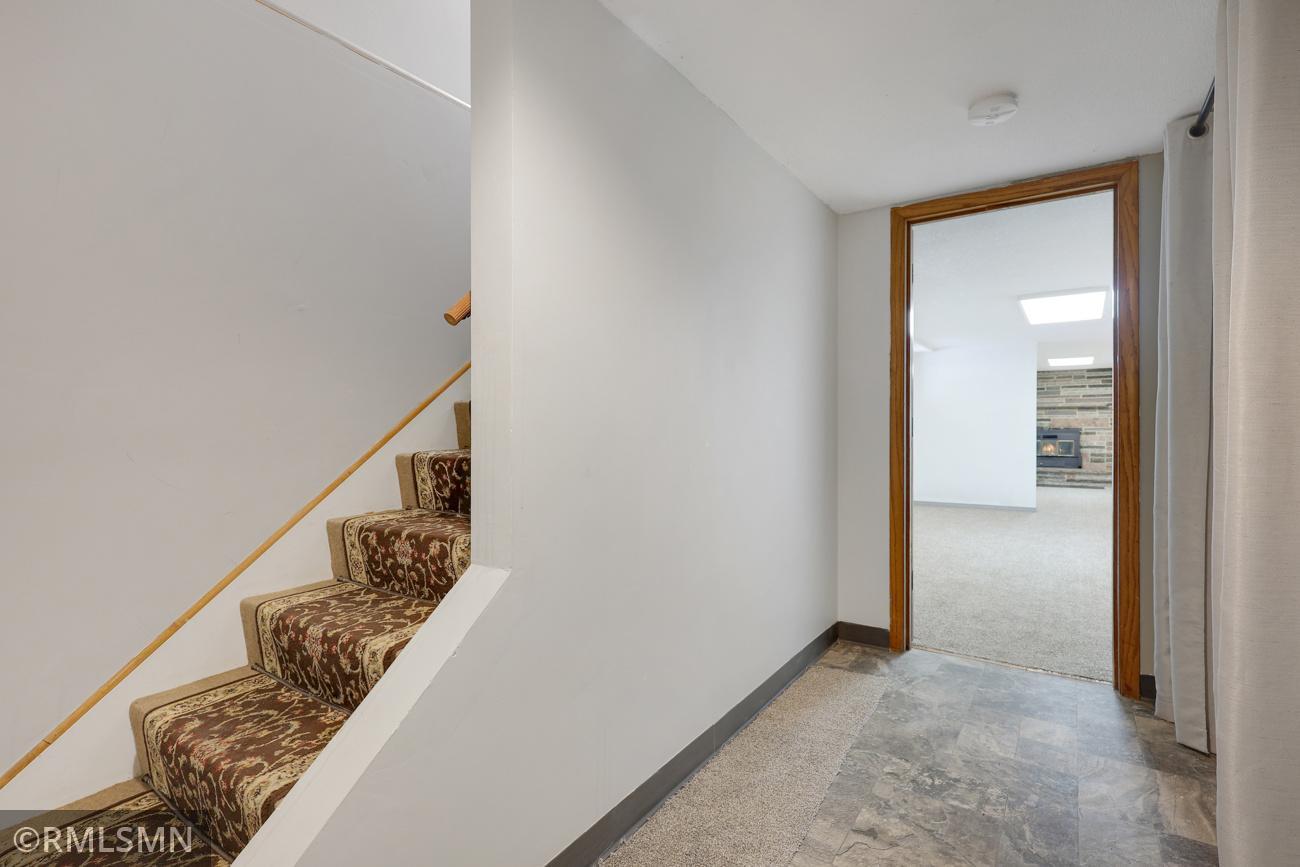 Front entry features a coat closet and opens to the finished basement with new carpet