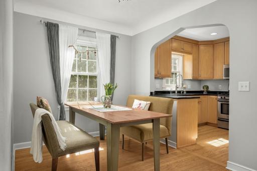 The dining room is open to the kitchen and offers a view of the backyard.