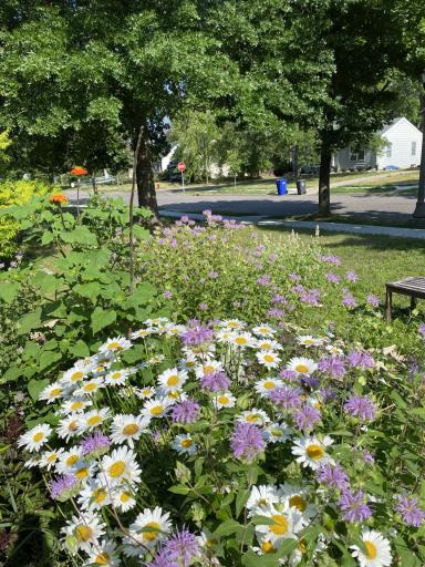 Wondrous perennial gardens adorn the yard.