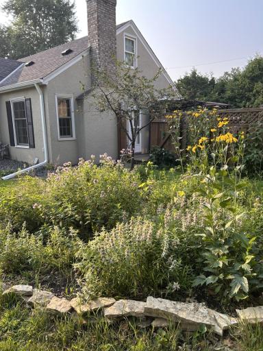 Wondrous perennial gardens adorn the yard.