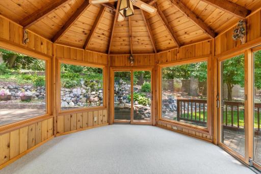Main level porch just off the kitchen. Windows keep the elements out.