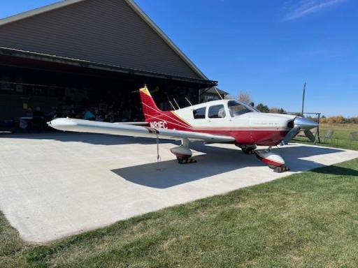 Concrete slab outside hangar with tie downs