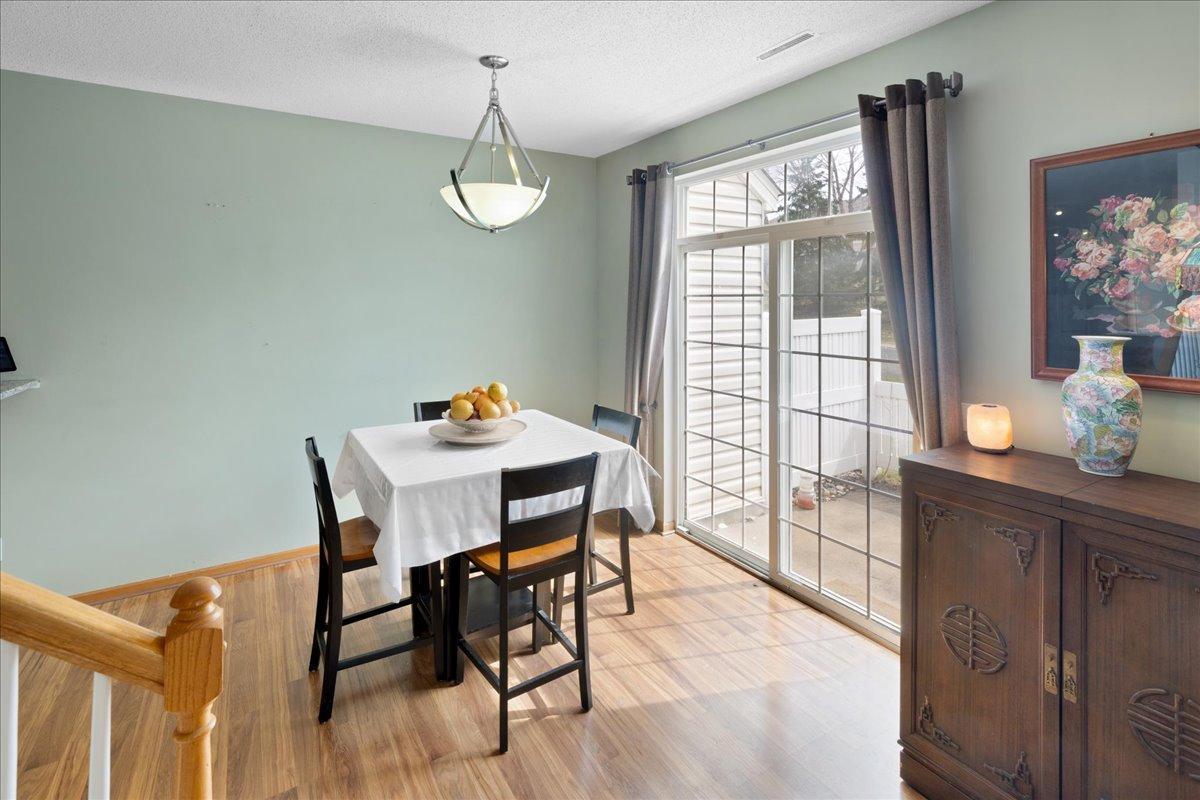 Informal dining space with sliding door access to private patio.