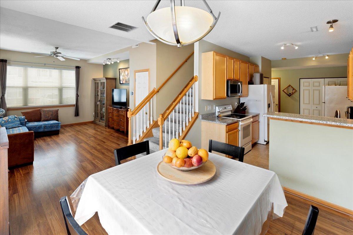 Dining area with breakfast bar overlooking main living area for added convenience
