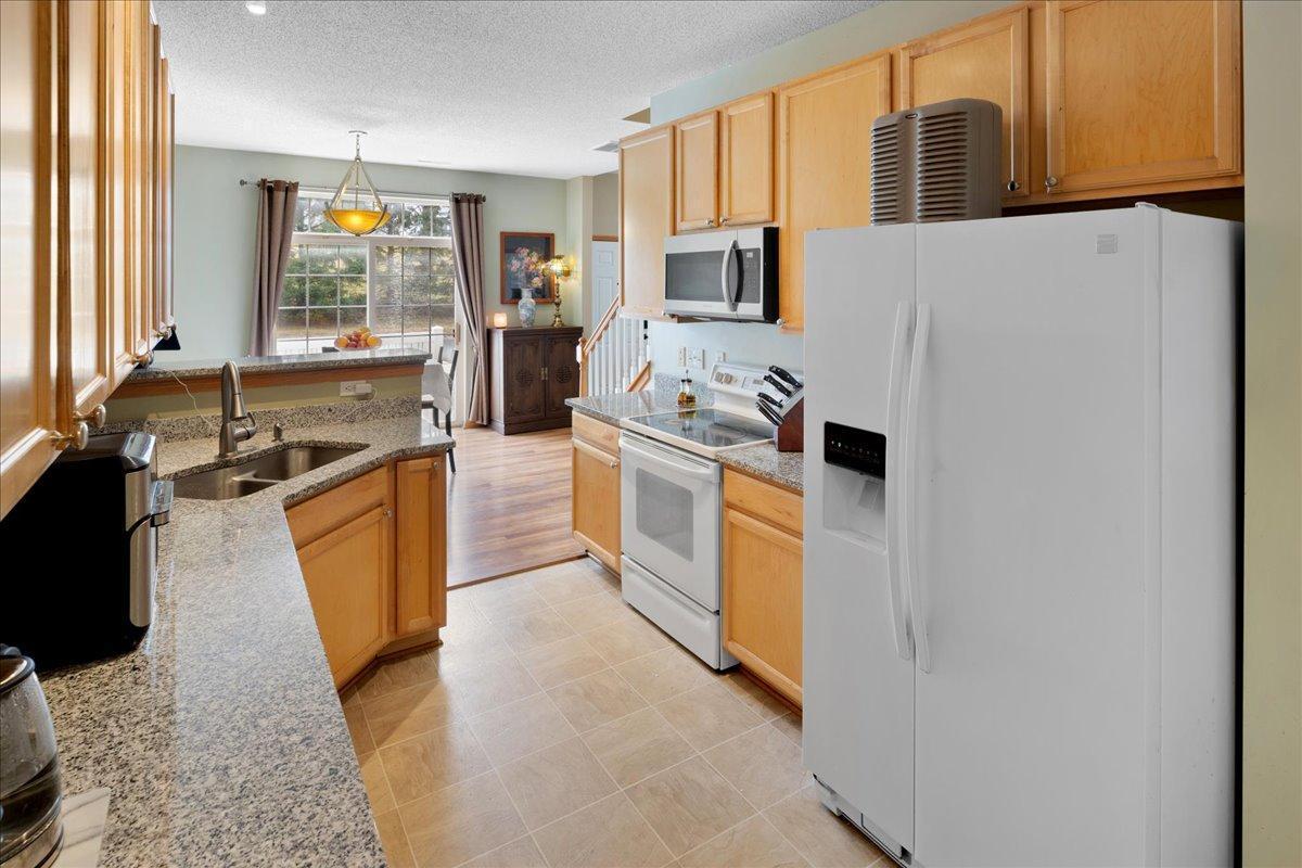 Open kitchen with clear views into dining and living spaces. Not pictured is a very large walk-in pantry & 1/2 bath on this level.