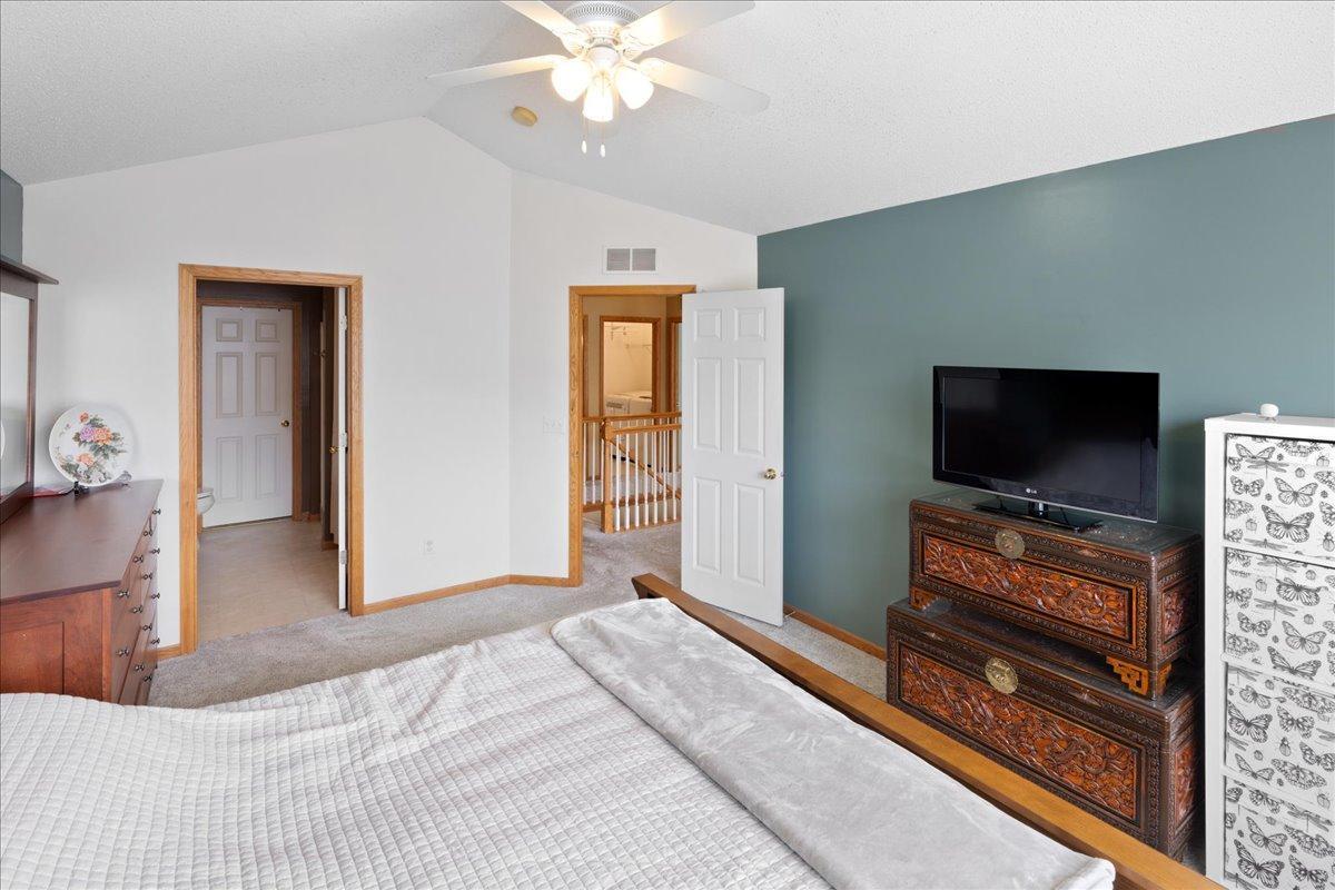 Large Primary bedroom with full bath and walk through closet.