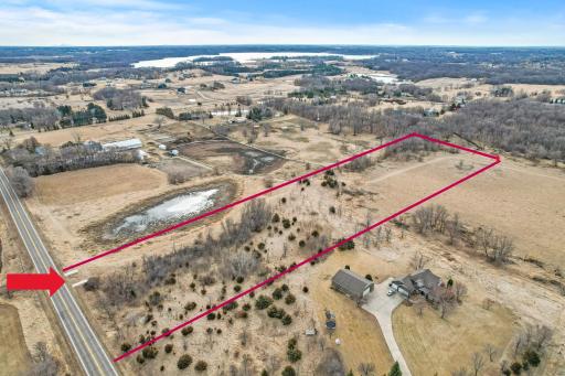 Aerial view of the property, arrow is where the approach and start of the driveway is