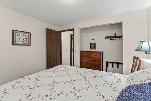 Lower level bedroom with view to hallway