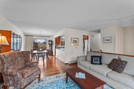 Family room with view to dining room and access to deck from patio door