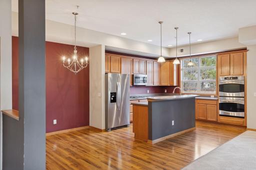 The well-appointed kitchen flows seamlessly into the dining and living areas, making it perfect for both everyday living and entertaining.