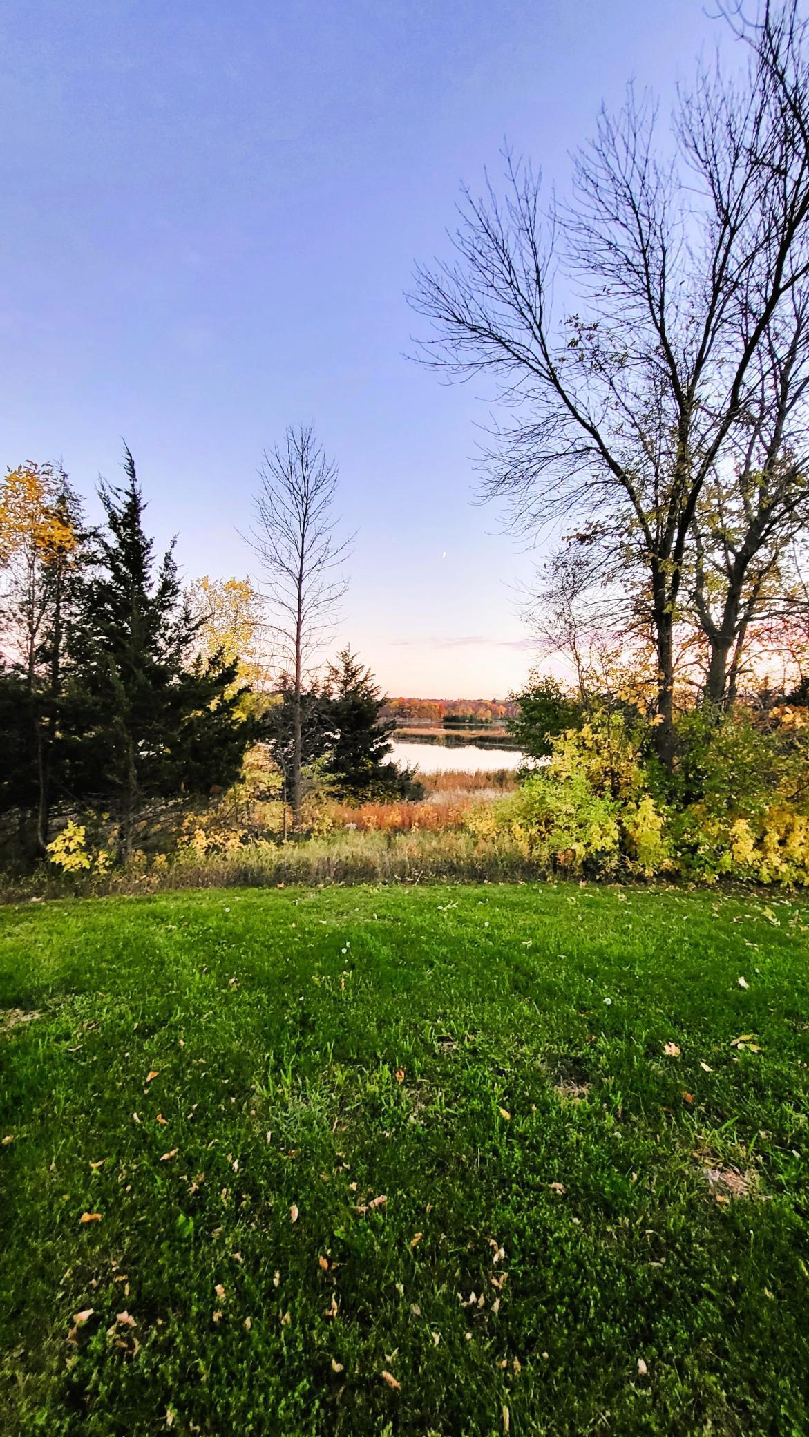 Look from where the front yard will be to the lake. The home front door would be on the edge of the grass in the middle of the photo.