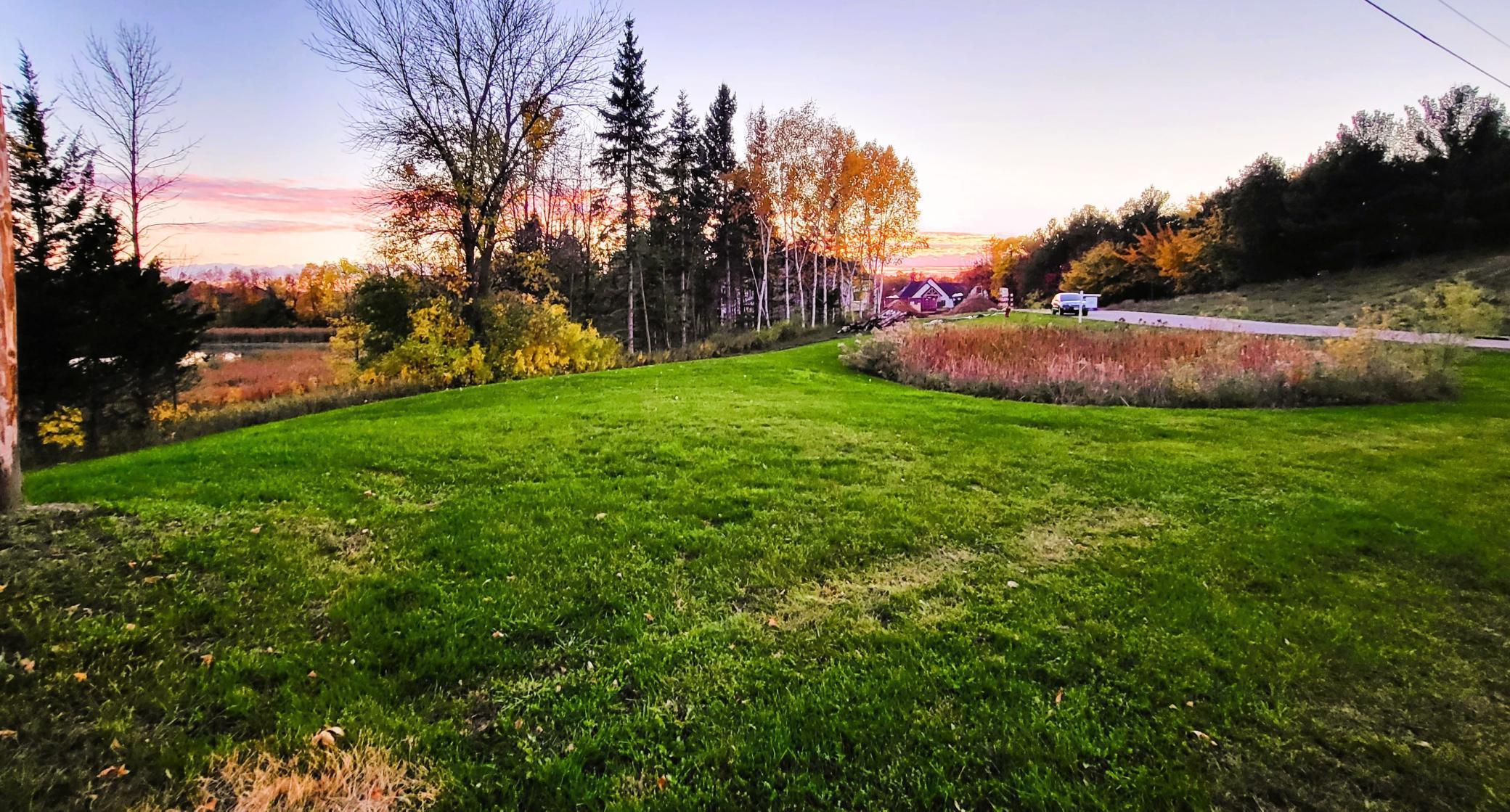 View from the North edge of the lot looking into the neighborhood with the lakefront on the left
