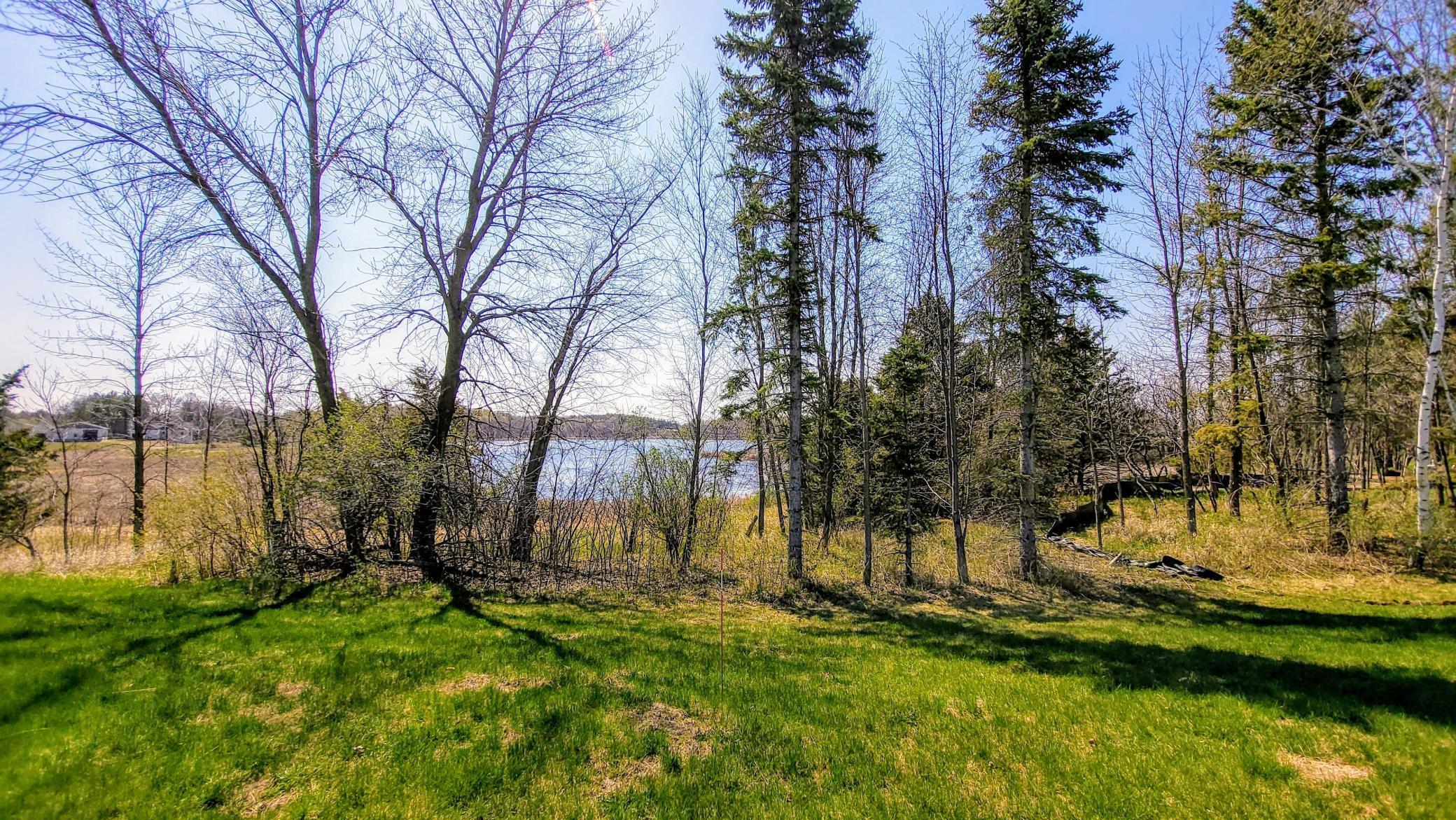 Southeast view from the front yard the location of the home. Home will be built behind the tree line with the front door approximately at on/at the tree line.