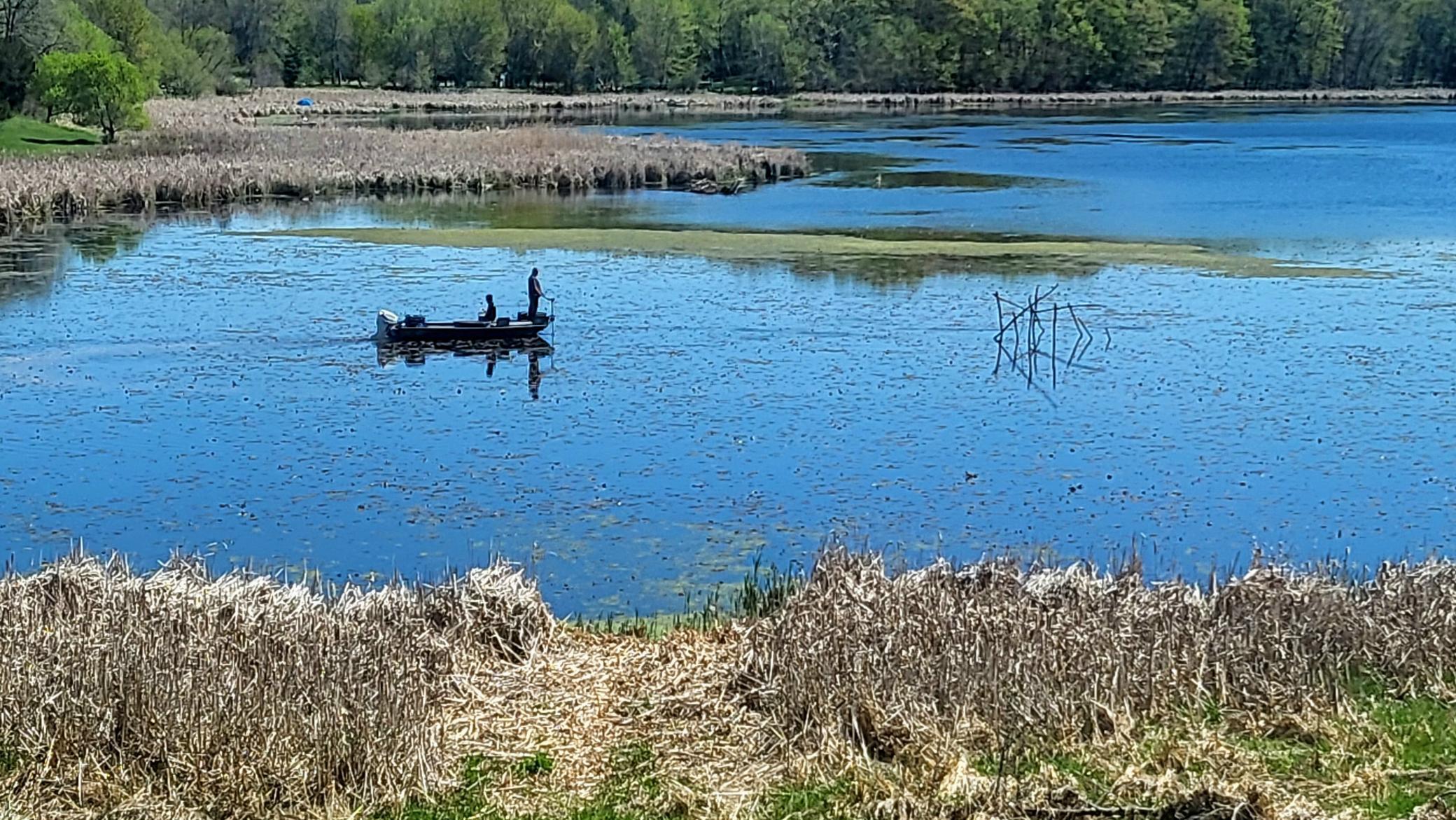 Fisherman in the bay on South Center Lake