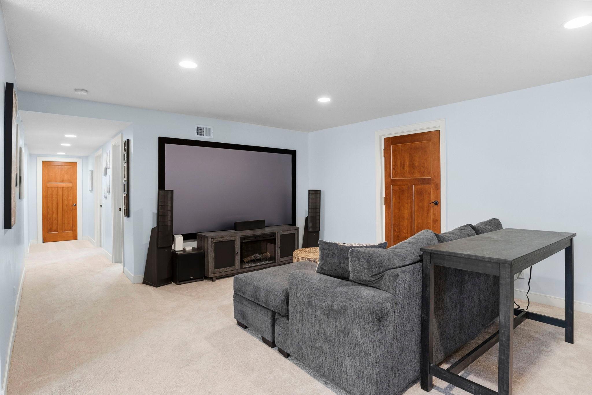 Cozy lower-level theatre perfect for movie nights.