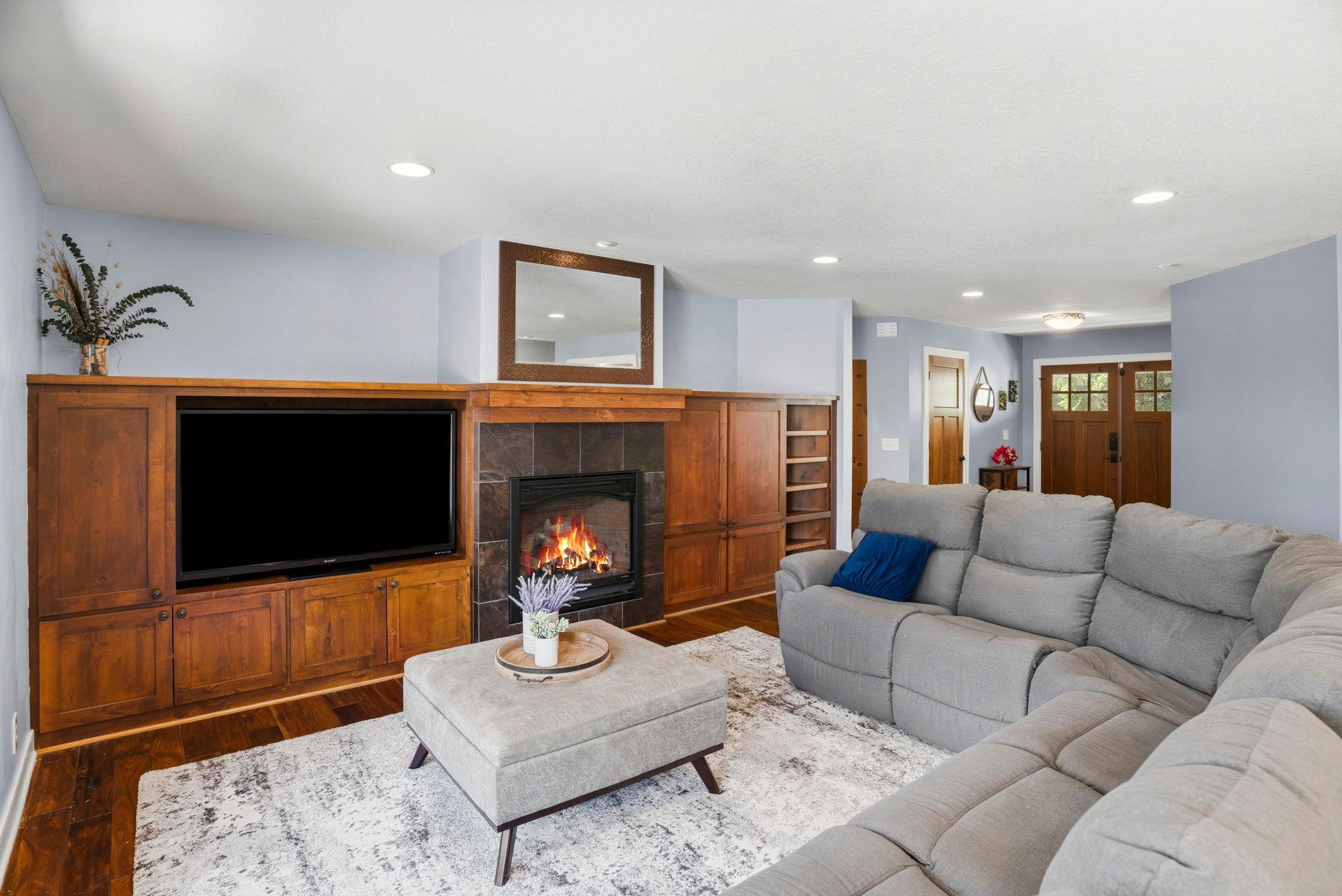 Cozy living room with a beautiful fireplace.
