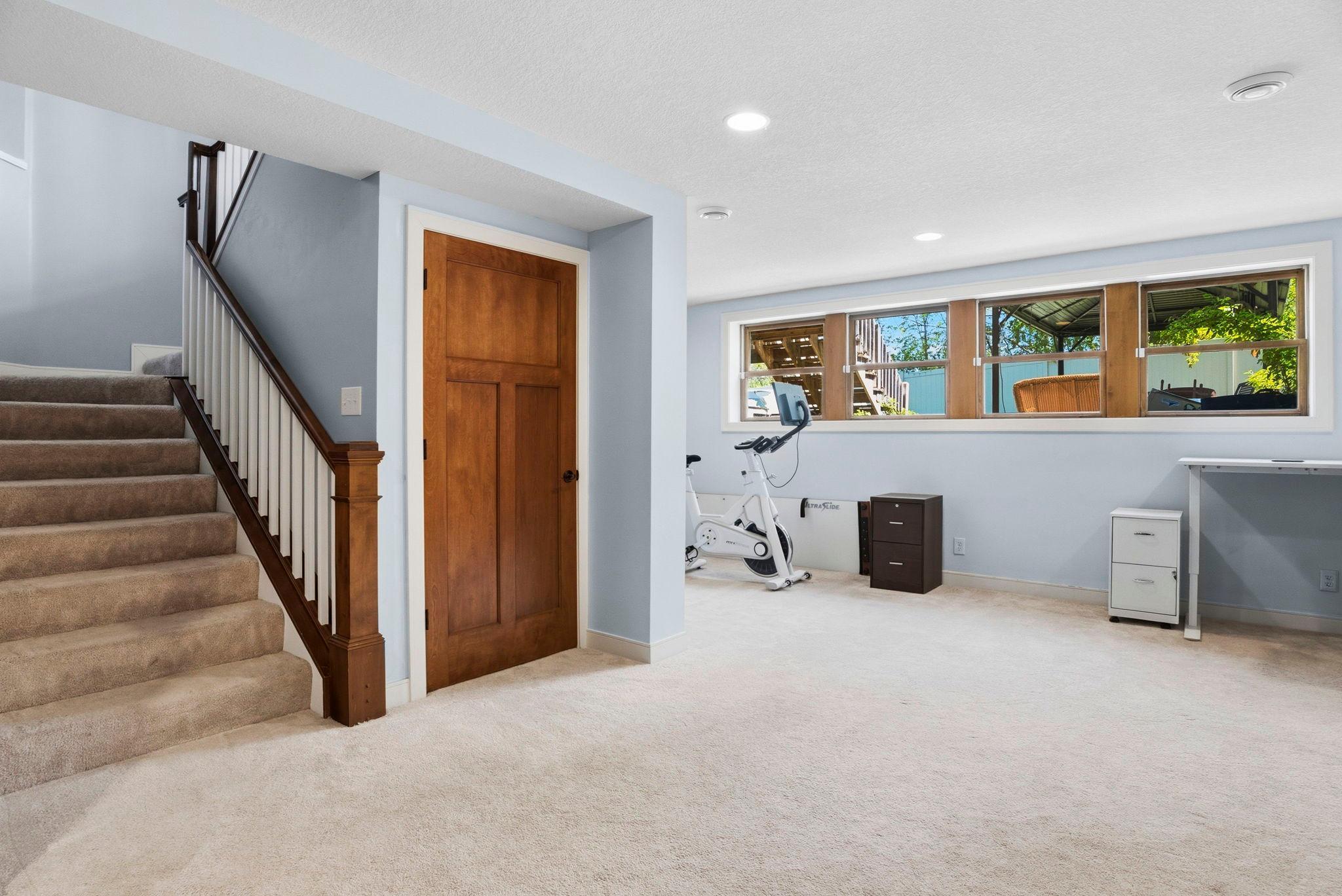 Large lower level with high ceilings and many new windows.