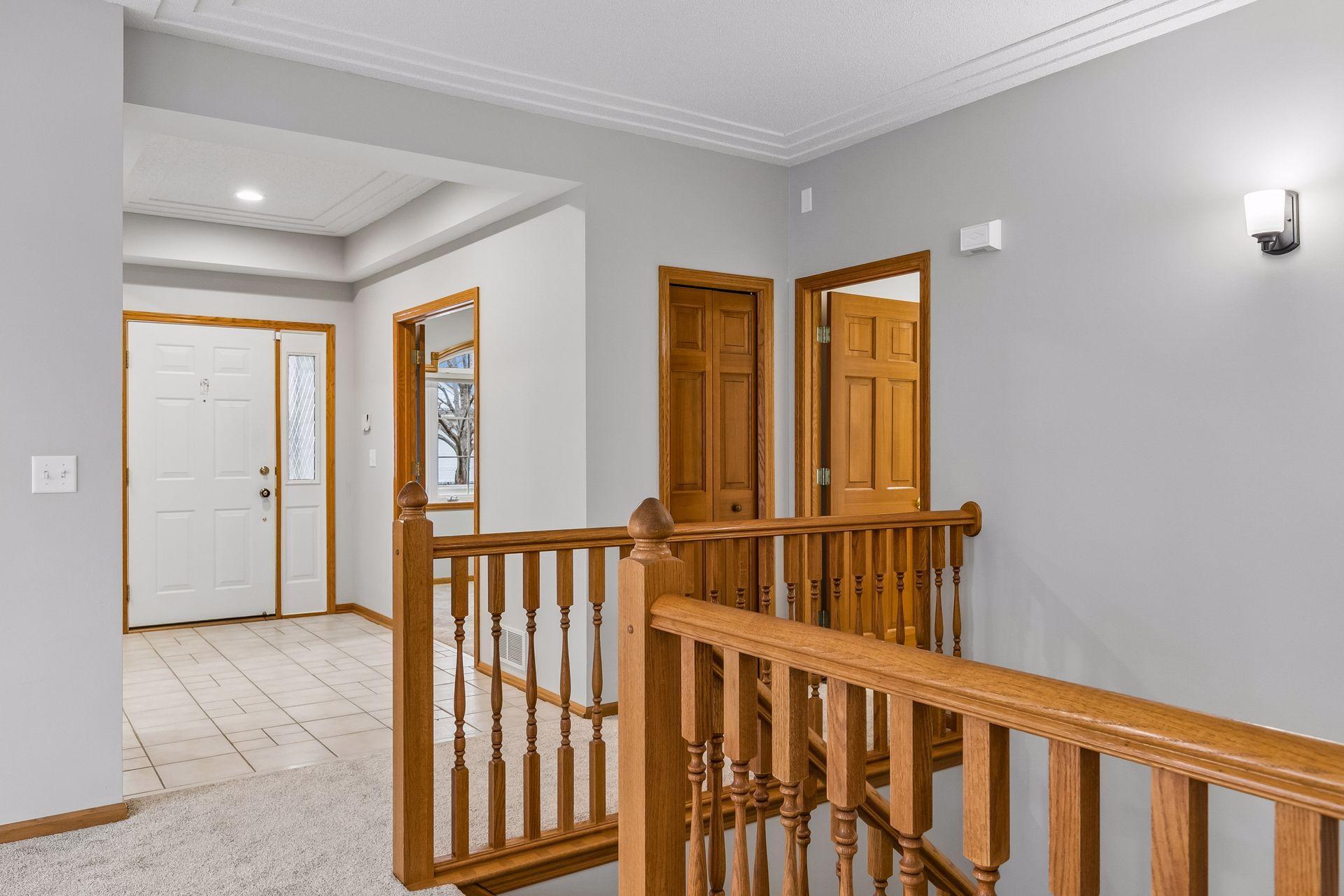 to the left as you walk in you will find the second bedroom, this room would be an excellent space for a main floor office. You can also see the entrance to the linen closet and the half bath from this picture