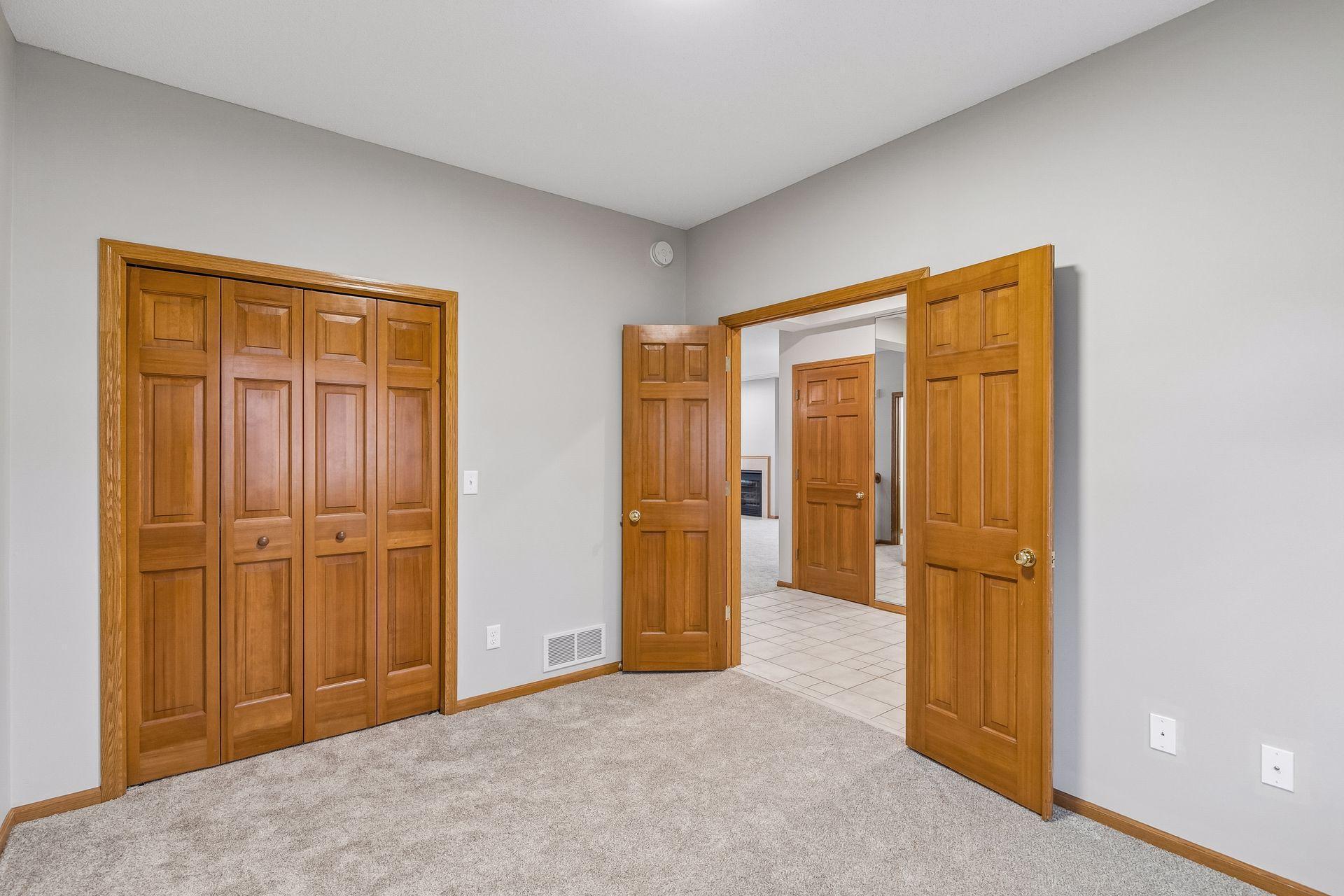 The Bedroom 2 / Office space has a double solid paneled door into the foyer and closet space
