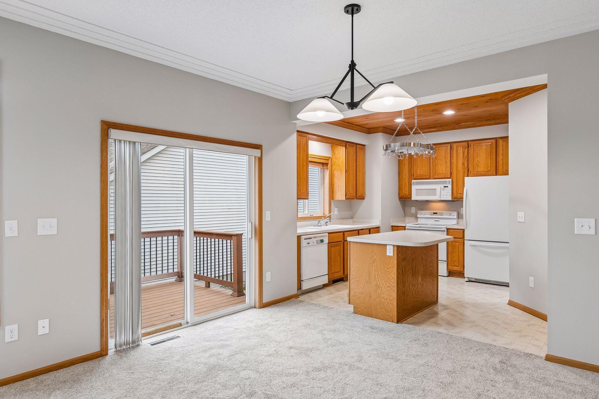 Dining Room walks out to the wrap around composite decking