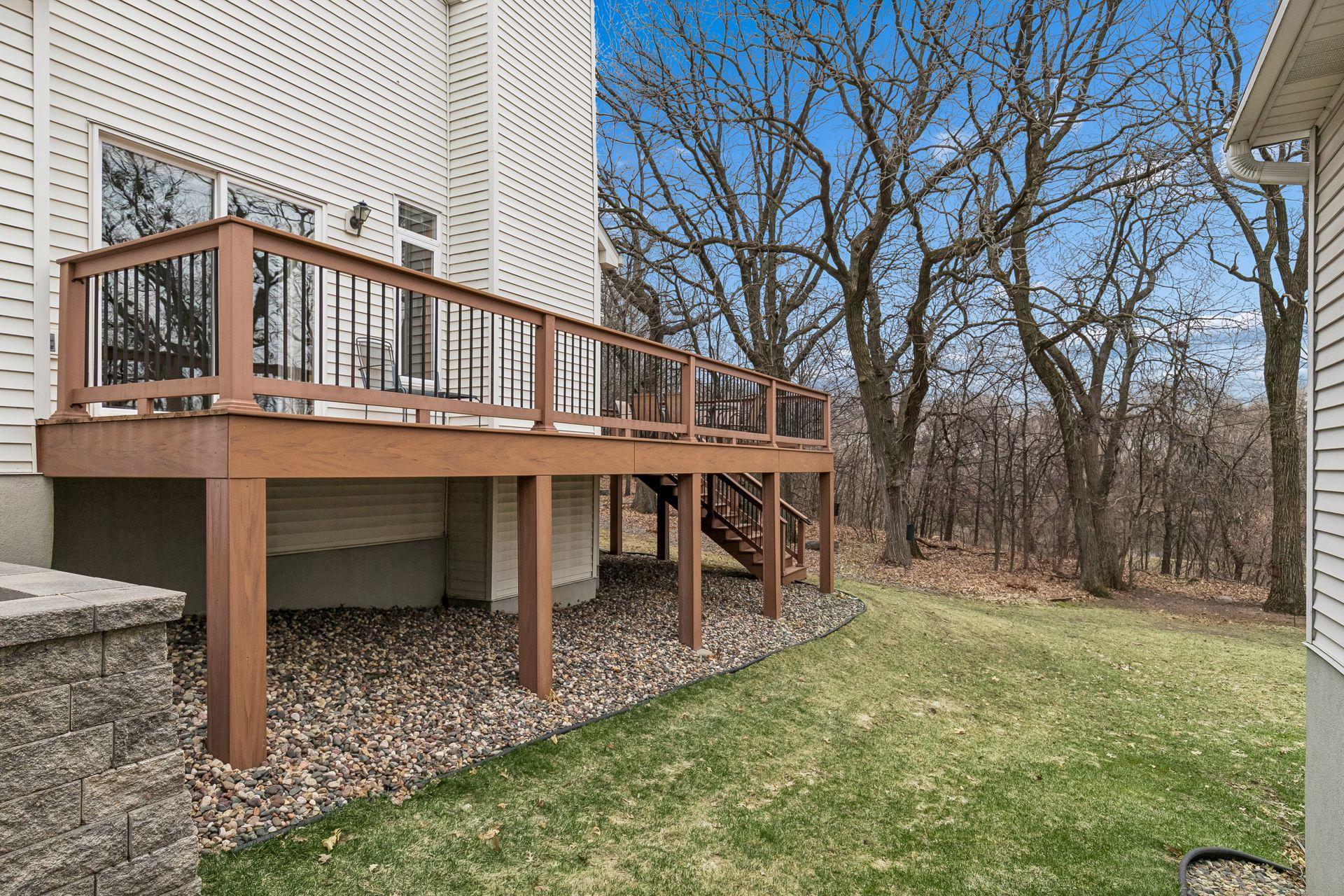 Look at that wrap around deck and the view out back...wonderful!