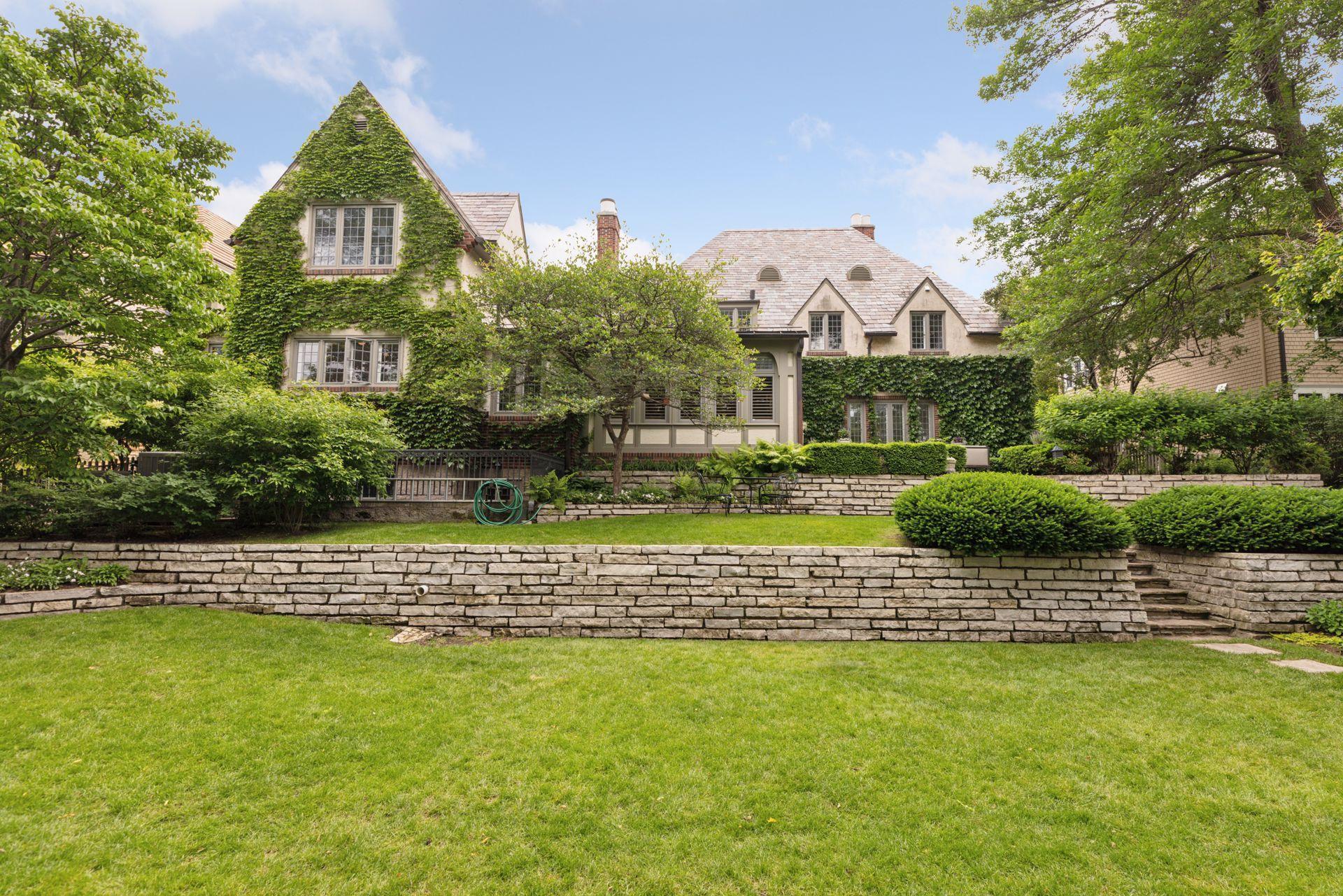 Wide, flat lawn with a terraced upper lawn. Inviting spaces for outdoor entertaining, relaxation, and lawn games. Privacy provided by perimeter fencing and landscaping. Irrigation.