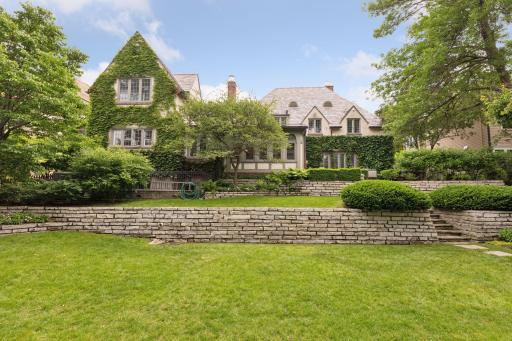 Wide, flat lawn with a terraced upper lawn. Inviting spaces for outdoor entertaining, relaxation, and lawn games. Privacy provided by perimeter fencing and landscaping. Irrigation.