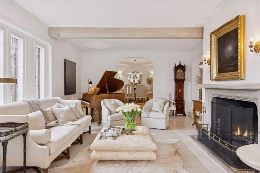 A wide arched doorway leads into the formal dining room.