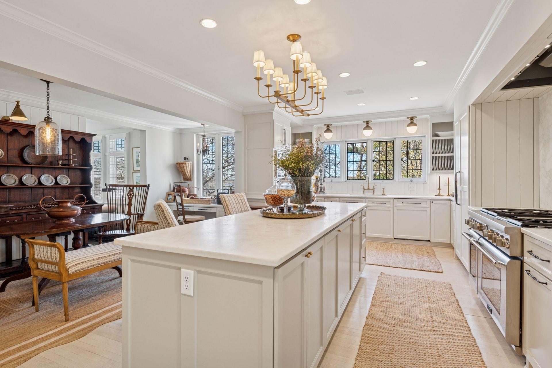 The large kitchen also features an informal dining area and built-in desk area.