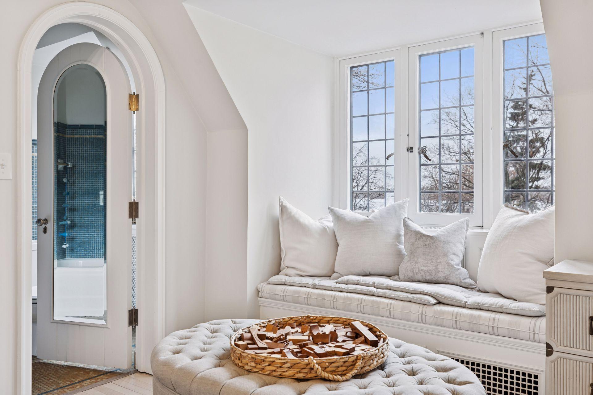 Third bedroom with en suite bath and built-in window seat looking to the west. Seasonal lake views. Sunset views year round.