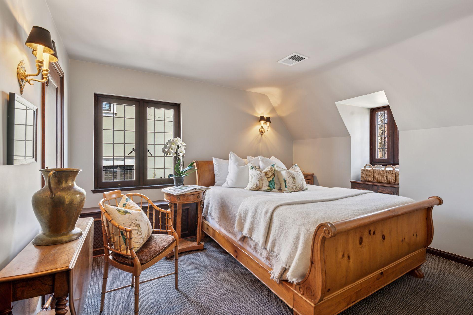 A hallway door leads to a separate bedroom wing with a 4th bedroom, 5th bedroom, and full hall bath providing a quiet and private space for guests, nannies, and larger families.