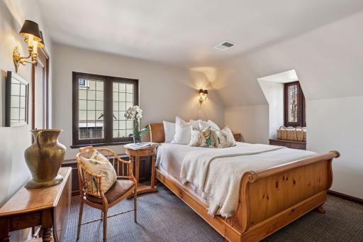 A hallway door leads to a separate bedroom wing with a 4th bedroom, 5th bedroom, and full hall bath providing a quiet and private space for guests, nannies, and larger families.