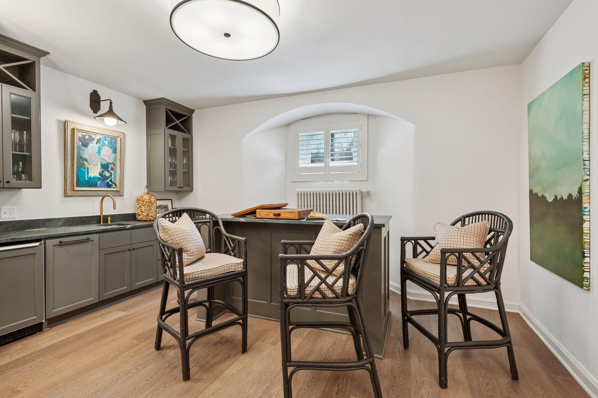 Lower level recreation room with wet bar, movable island, and built-in ice maker.