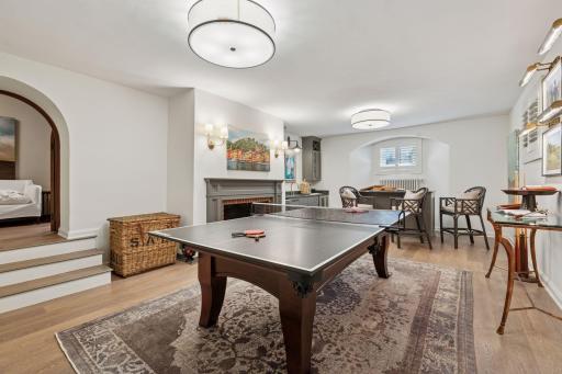 Lower level recreation room. The fireplace is currently decorative only with an existing gas line for a future insert, if desired.