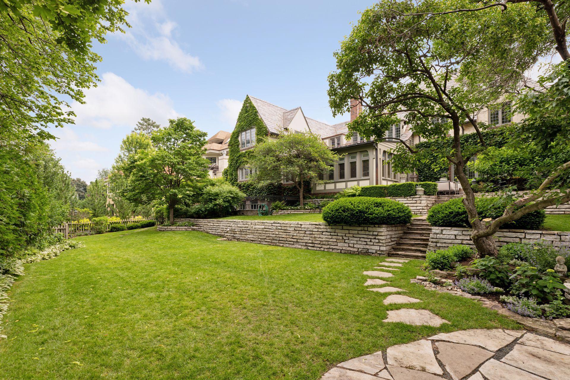 This yard is a dream for lawn games and entertaining. A full perimeter fence and mature hedges provide privacy.