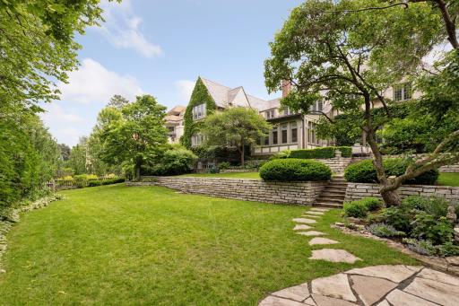 This yard is a dream for lawn games and entertaining. A full perimeter fence and mature hedges provide privacy.