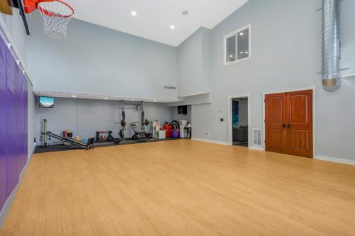 The sport court also features a space for your home gym, access to the backyard, and a window where you can easily call everyone for dinner.